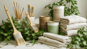 Eco-friendly paint supplies styled with natural elements, bamboo brushes, low-VOC paint cans, greenery, and organic cotton drop cloths arranged in soft, feminine styling